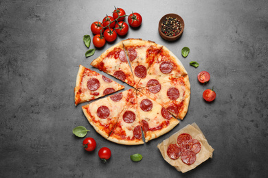 Photo of Flat lay composition with hot pepperoni pizza on grey  table