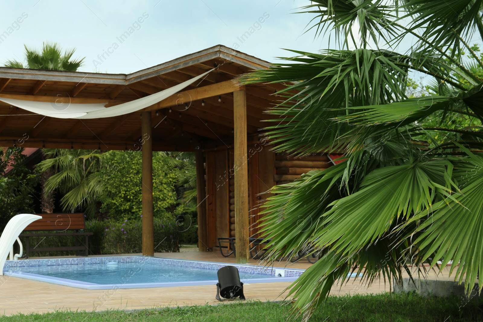 Photo of Outdoor swimming pool with clear water at resort