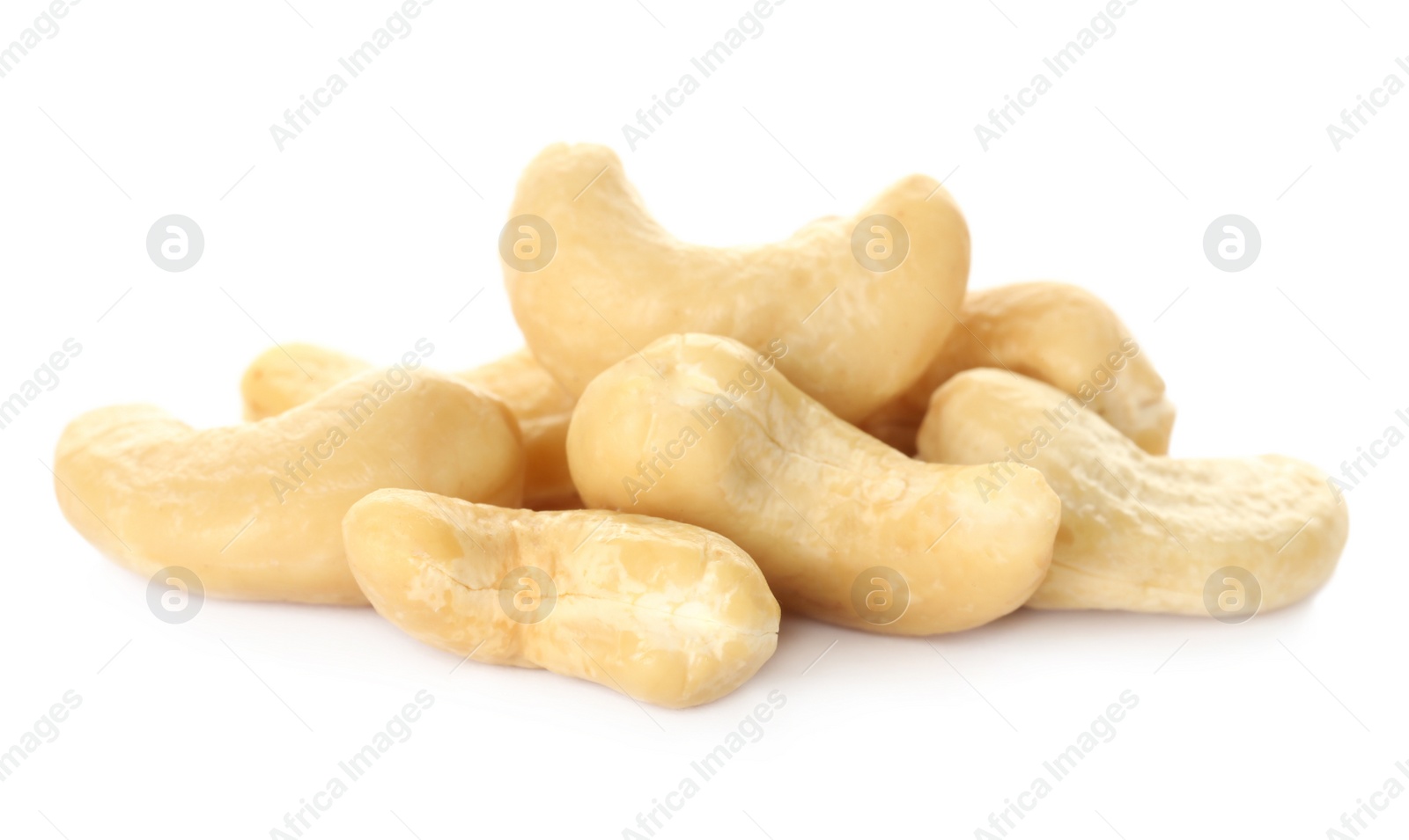 Photo of Pile of tasty organic cashew nuts isolated on white