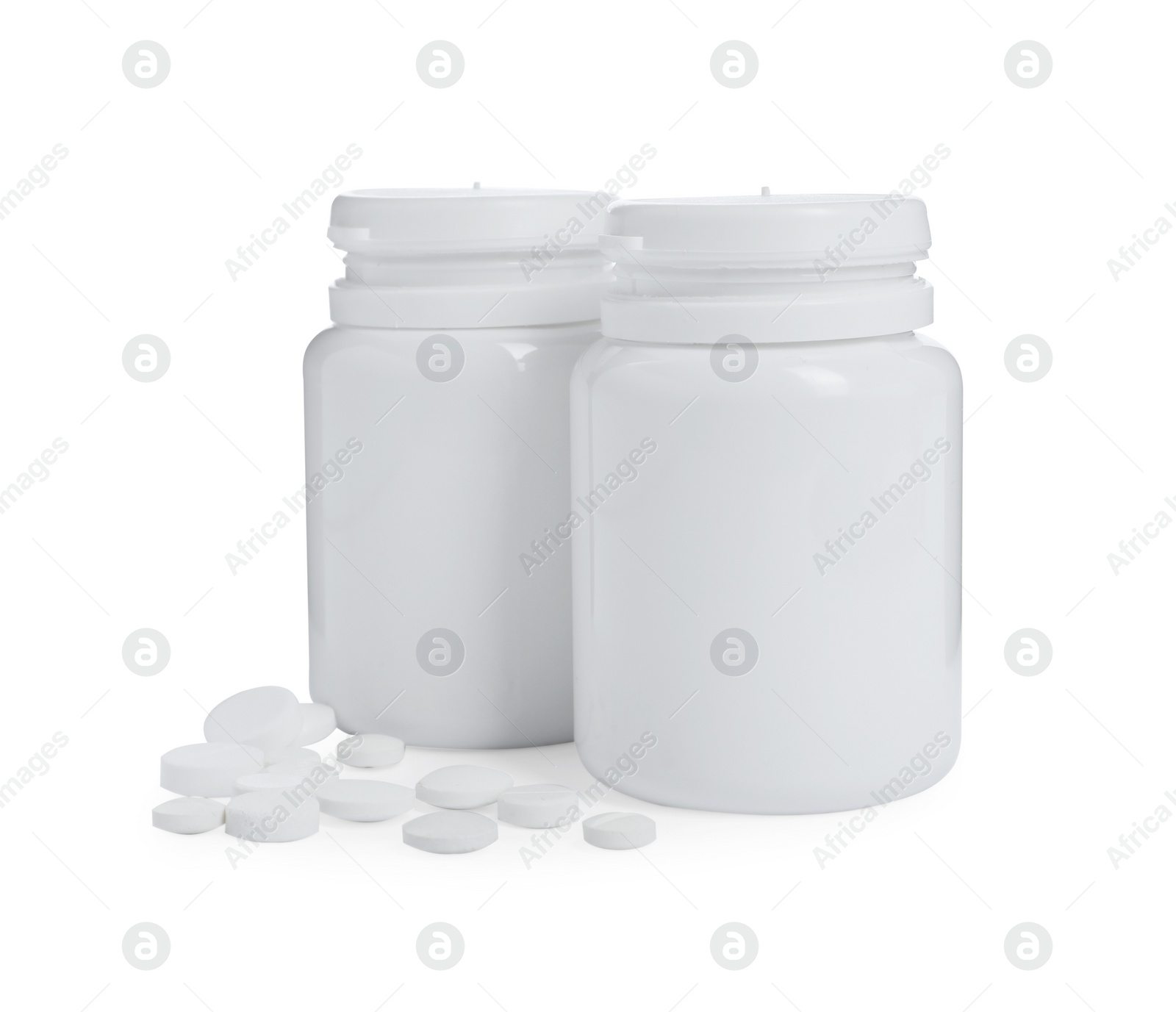 Photo of Two bottles with pills on white background