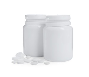 Two bottles with pills on white background