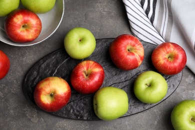 Fresh ripe green apples on black table, flat lay