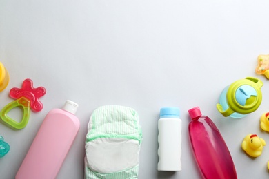 Photo of Flat lay composition with baby accessories and space for text on light background