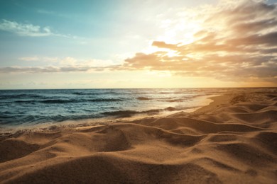 Photo of Picturesque view of beautiful sky with clouds over tropical beach at sunset