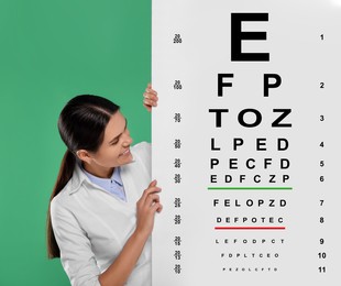 Ophthalmologist with vision test chart on green background