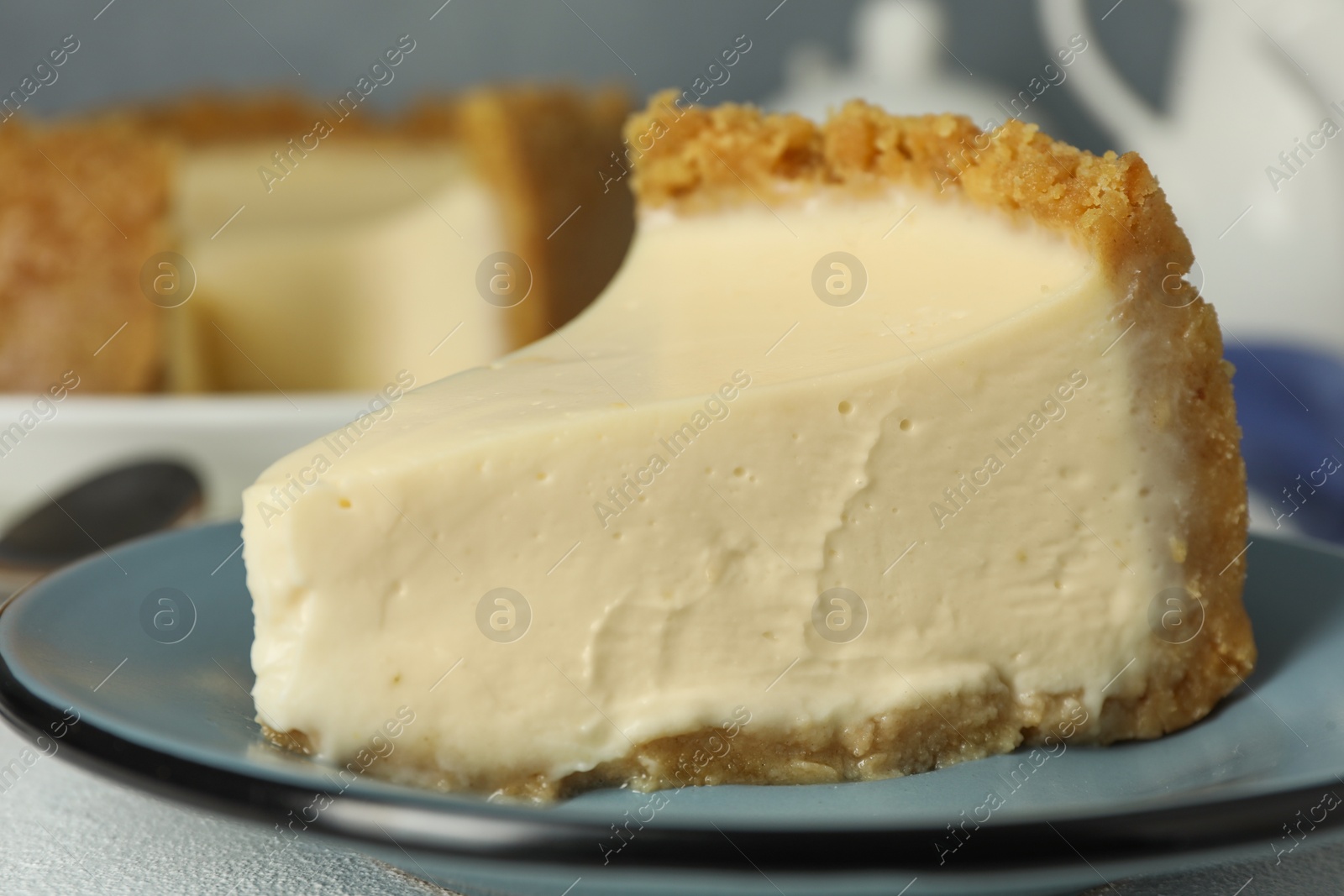 Photo of Piece of tasty vegan tofu cheesecake on table, closeup