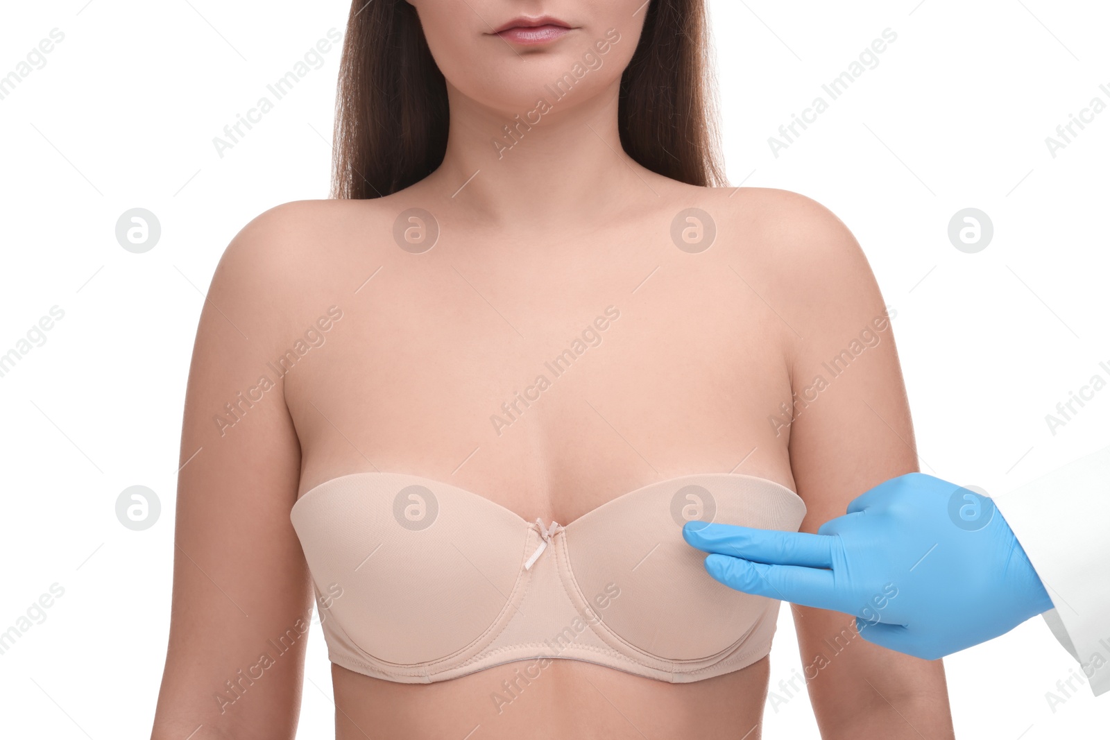 Photo of Mammologist checking woman's breast on white background, closeup