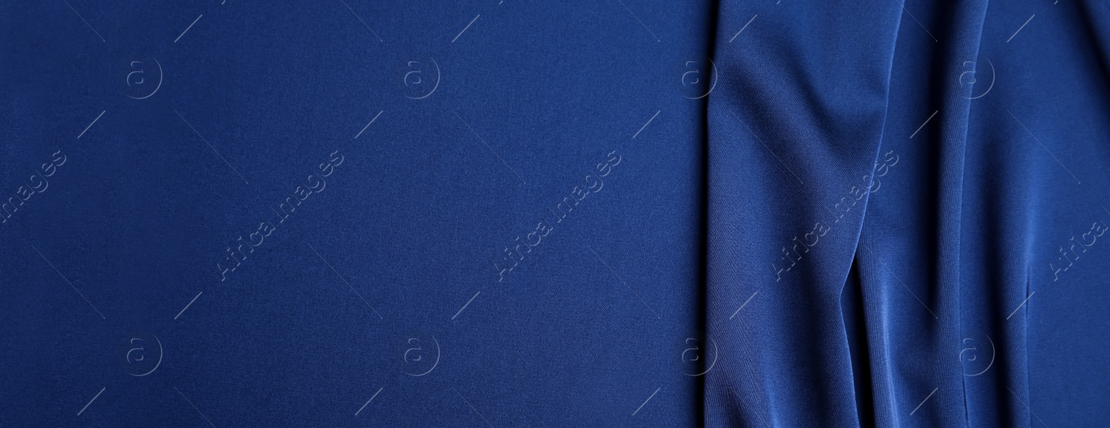 Image of Dark blue silk fabric as background, top view with space for text. Banner design