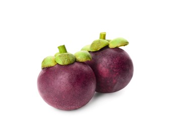 Photo of Delicious ripe mangosteen fruits on white background