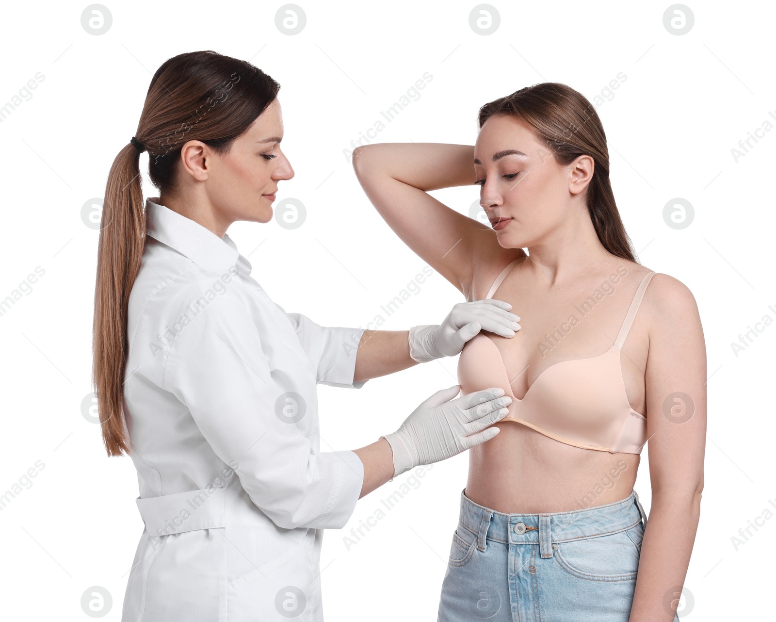 Photo of Mammologist checking woman's breast on white background