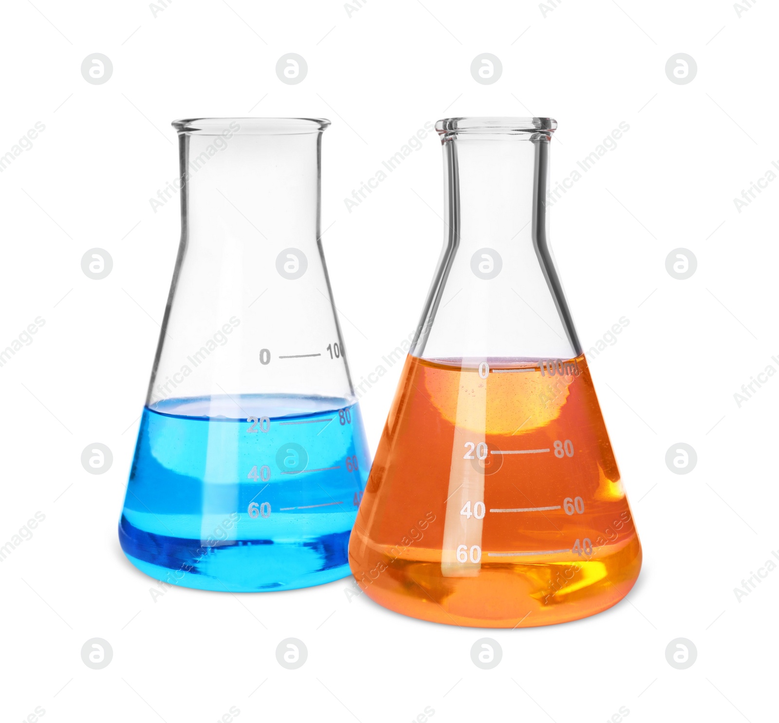 Photo of Laboratory glassware with colorful liquids on white background