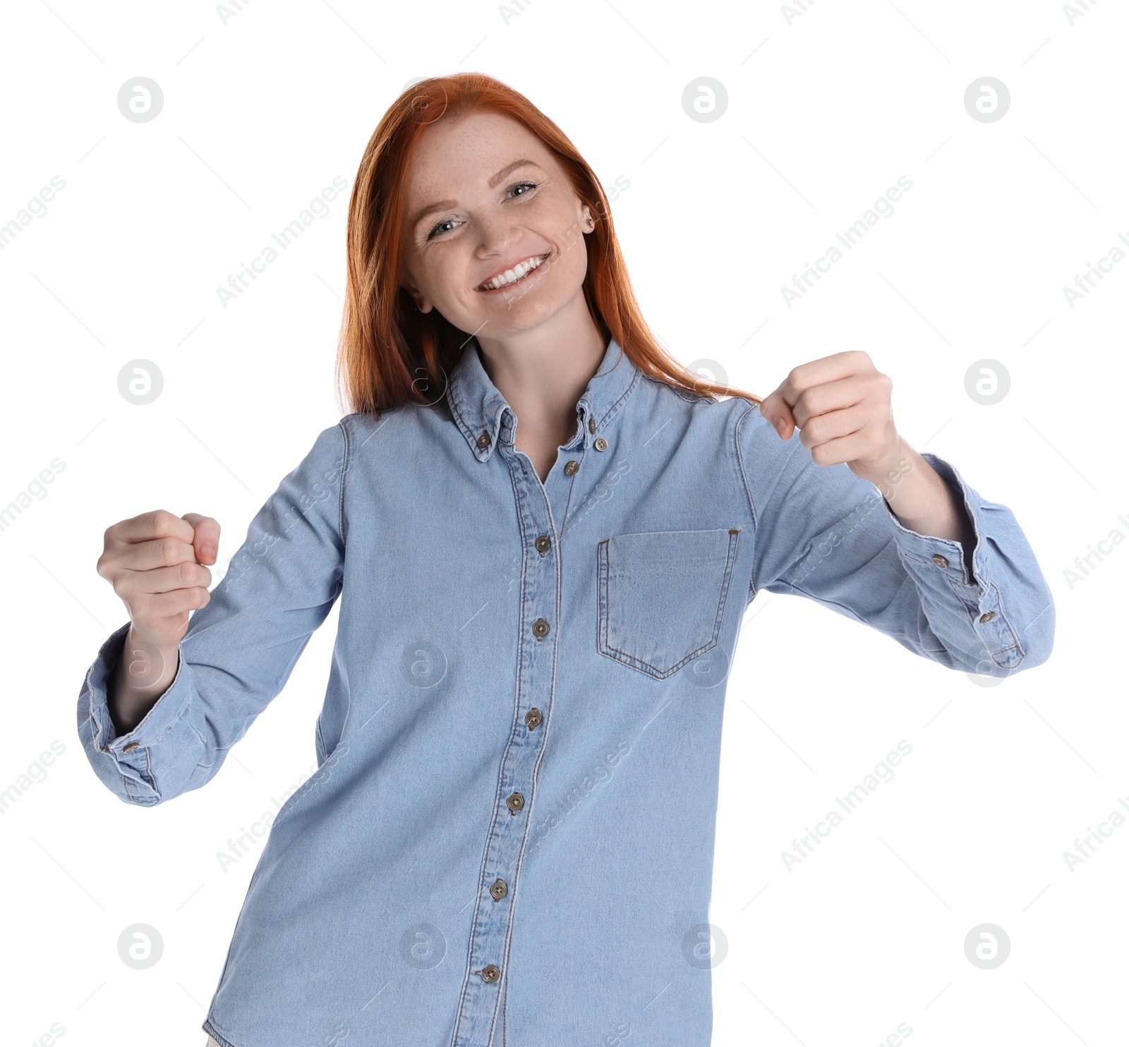 Photo of Happy young woman pretending to drive car on white background