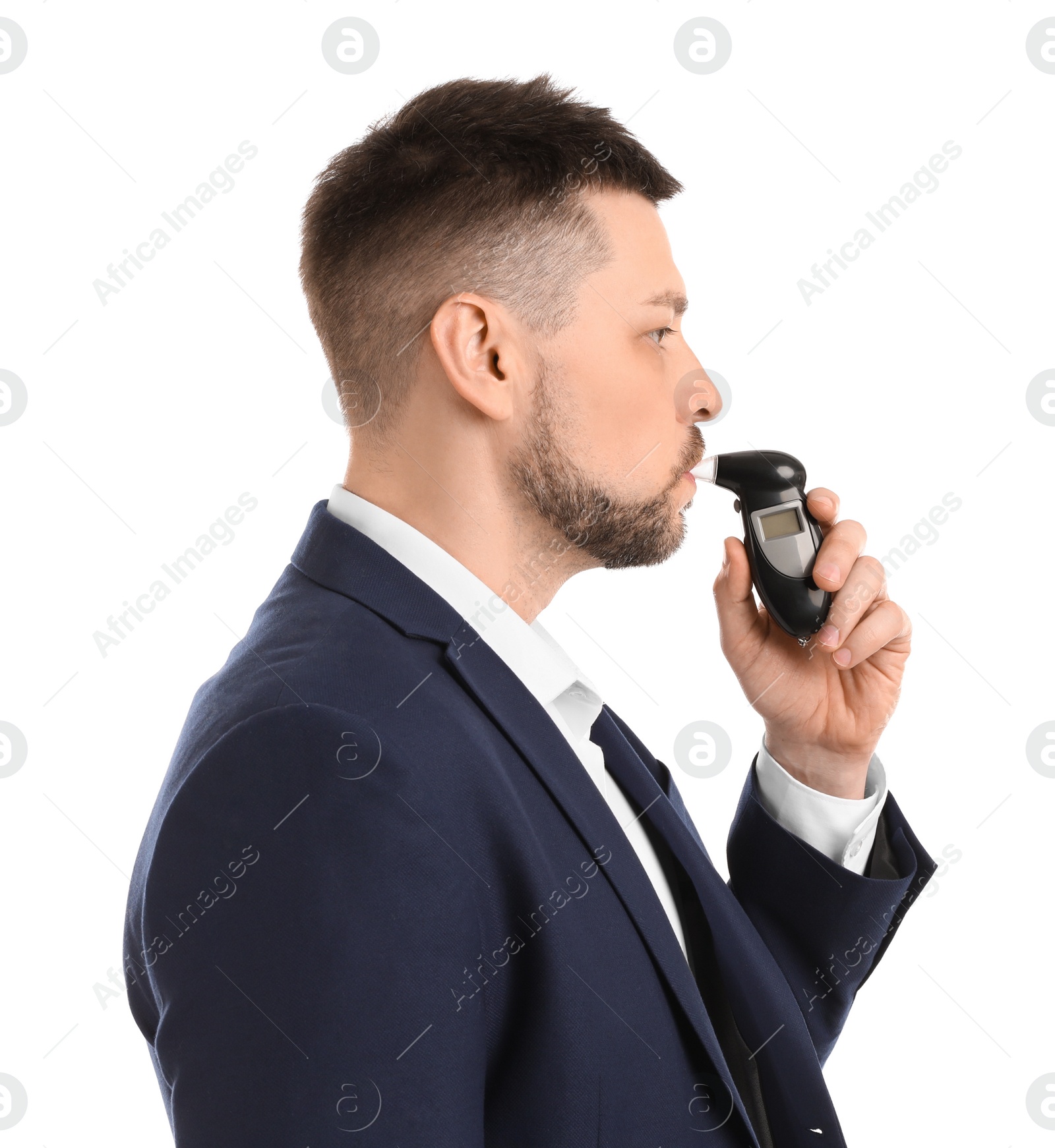 Photo of Man blowing into breathalyzer on white background