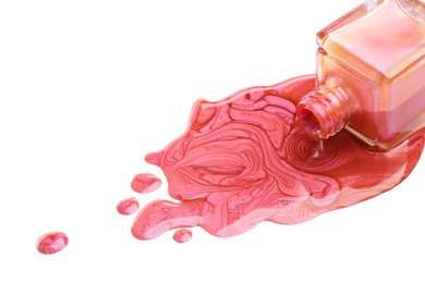 Photo of Overturned bottle of bright nail polish on white background, closeup