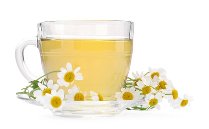 Aromatic herbal tea in glass cup and chamomiles isolated on white