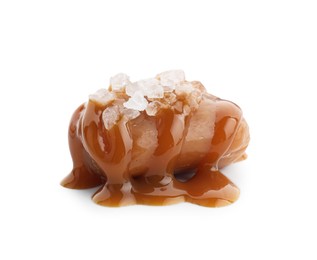 Photo of Yummy candy with caramel sauce and sea salt isolated on white
