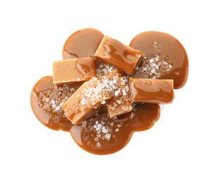 Yummy candies with caramel sauce and sea salt isolated on white, top view