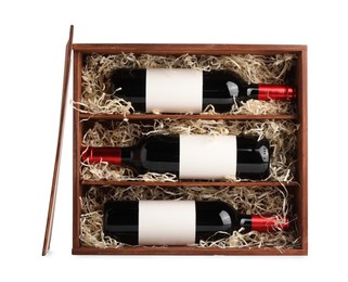 Photo of Wooden gift box with wine bottles isolated on white