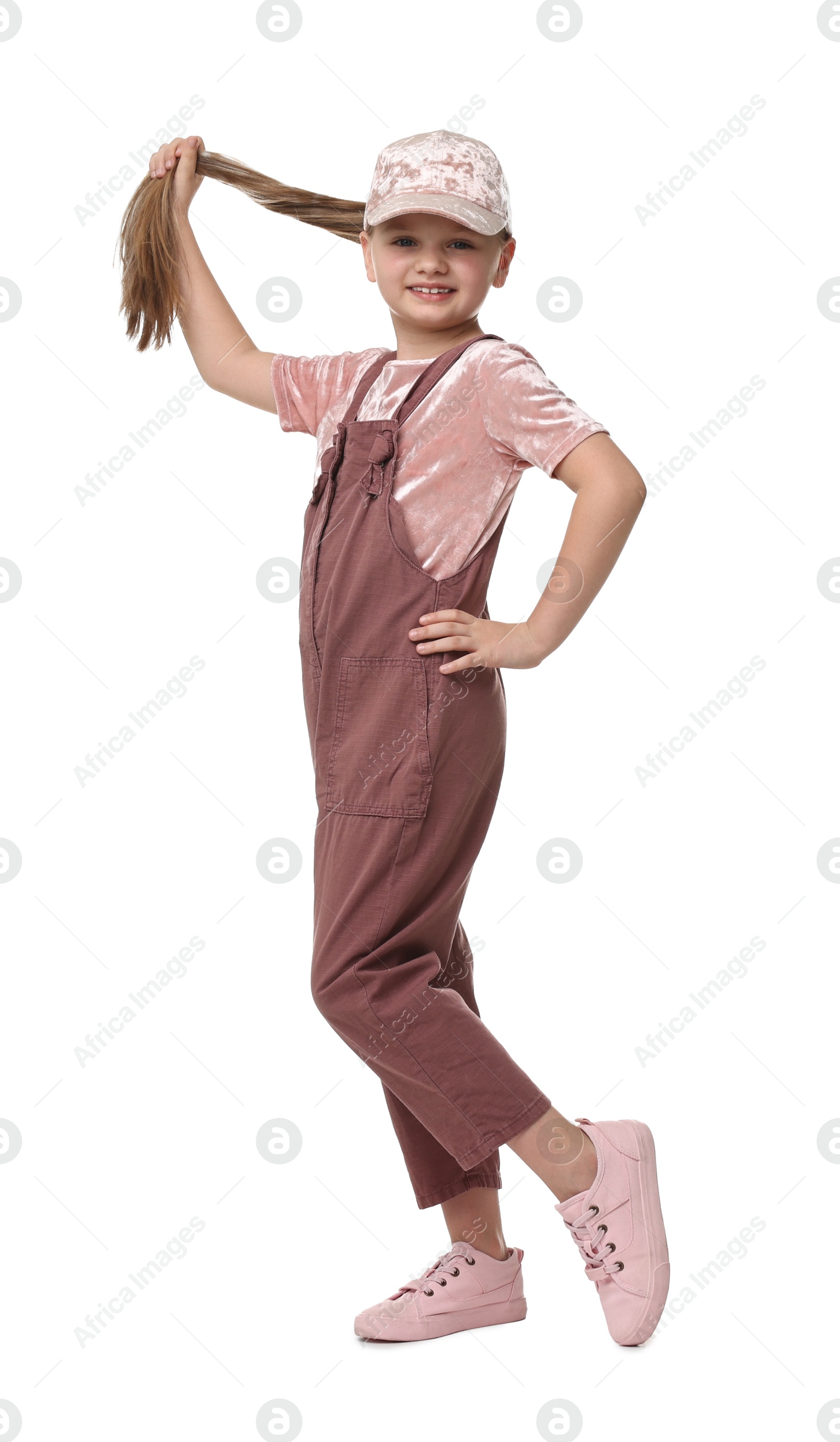 Photo of Cute little girl dancing on white background