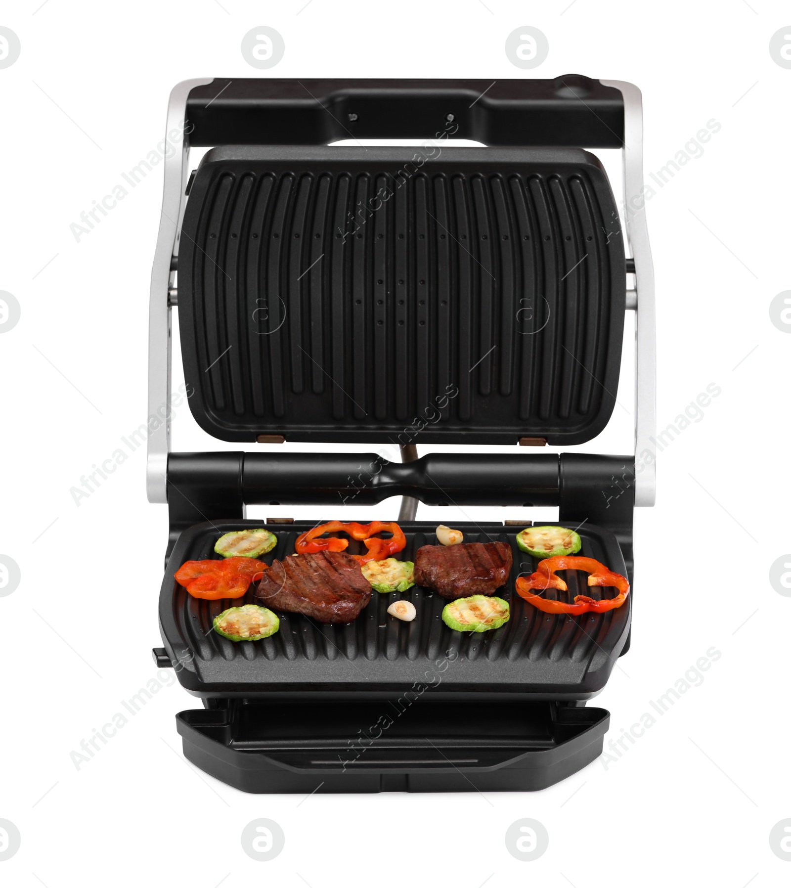 Photo of Electric grill with tasty meat and vegetables isolated on white