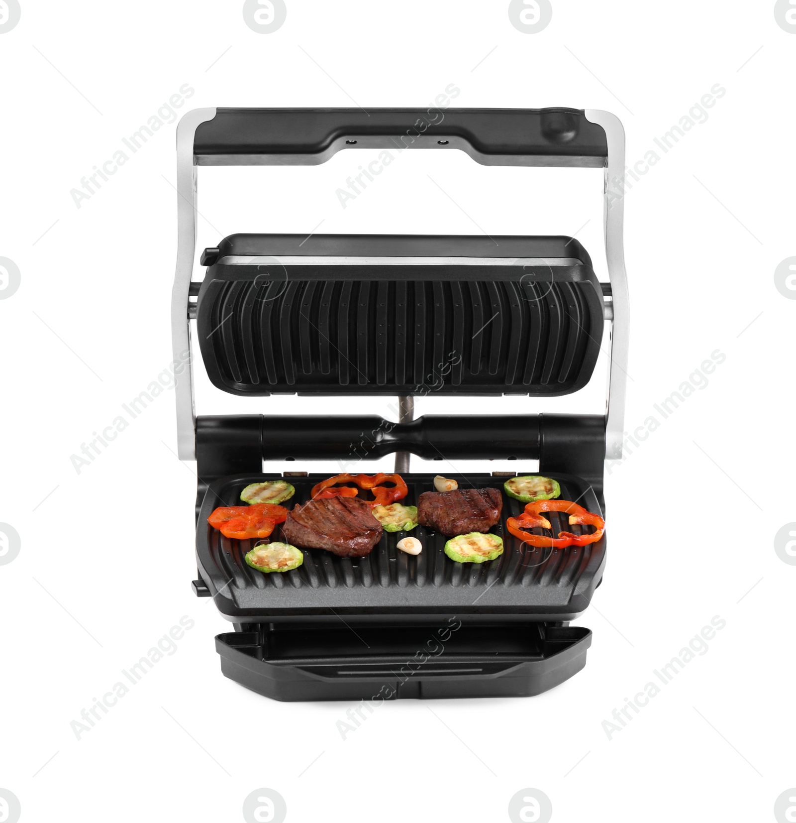 Photo of Electric grill with tasty meat and vegetables isolated on white