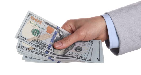 Money exchange. Woman holding dollar banknotes on white background, closeup