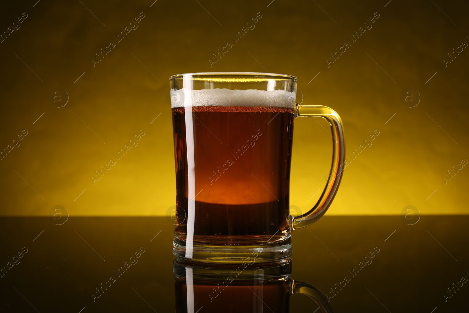Photo of Glass of beer with froth on dark table, closeup