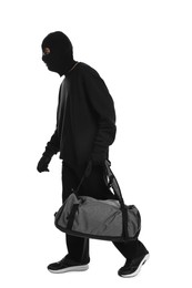 Photo of Thief in balaclava with bag on white background