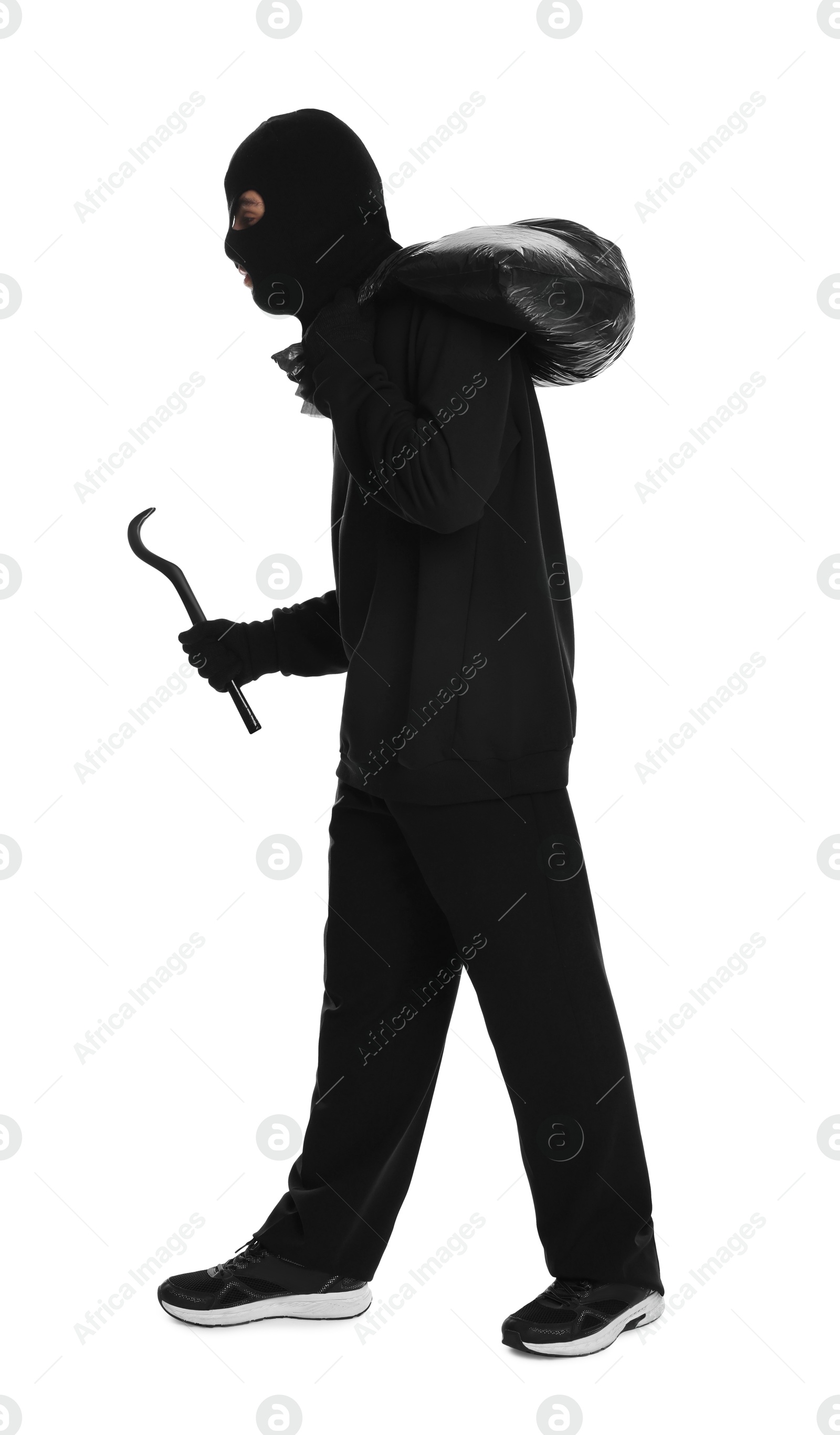 Photo of Thief in balaclava with crowbar and bag on white background