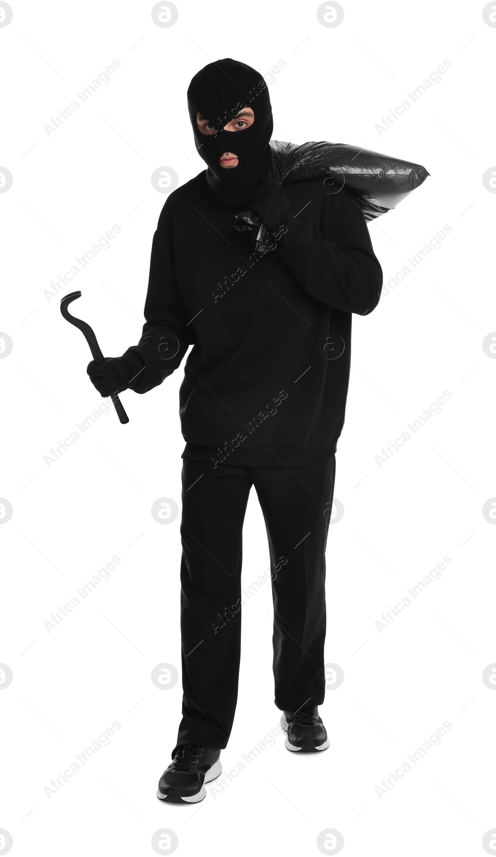 Photo of Thief in balaclava with crowbar and bag on white background