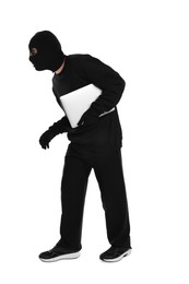 Thief in balaclava sneaking with laptop on white background