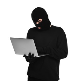 Thief in balaclava with laptop on white background