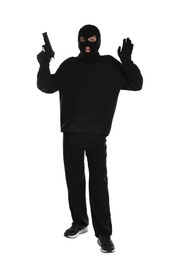 Photo of Emotional thief in balaclava with gun raising hands on white background
