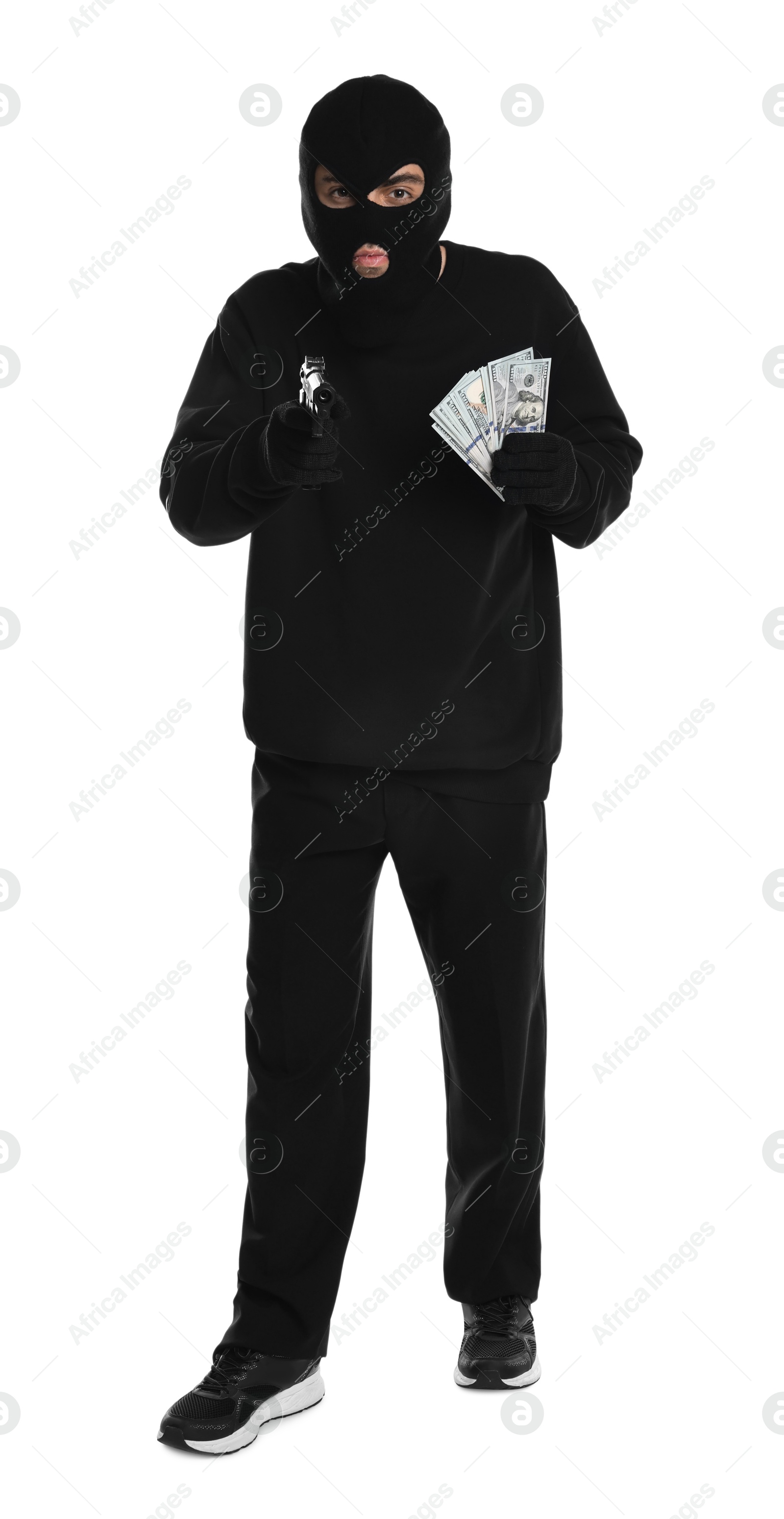 Photo of Thief in balaclava with gun and money on white background