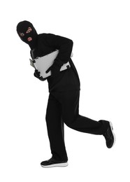 Thief in balaclava with briefcase of money running on white background