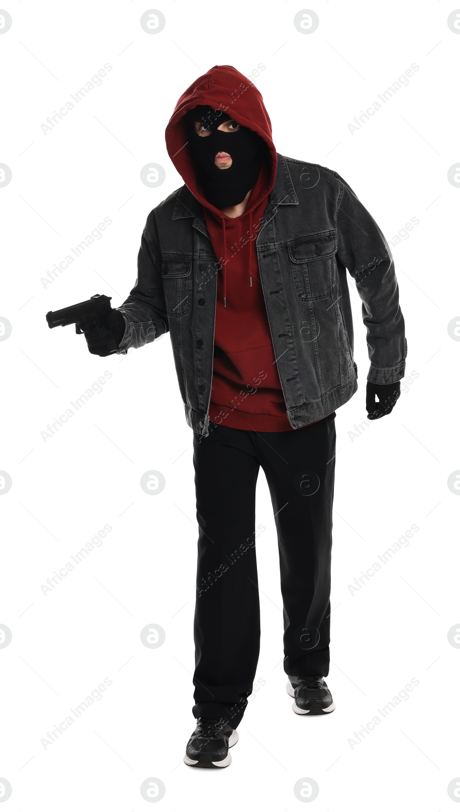 Photo of Thief in balaclava with gun on white background