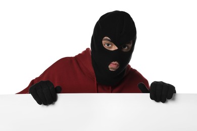 Photo of Thief in balaclava and gloves on white background