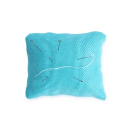 Photo of Light blue pincushion with sewing needles isolated on white, top view