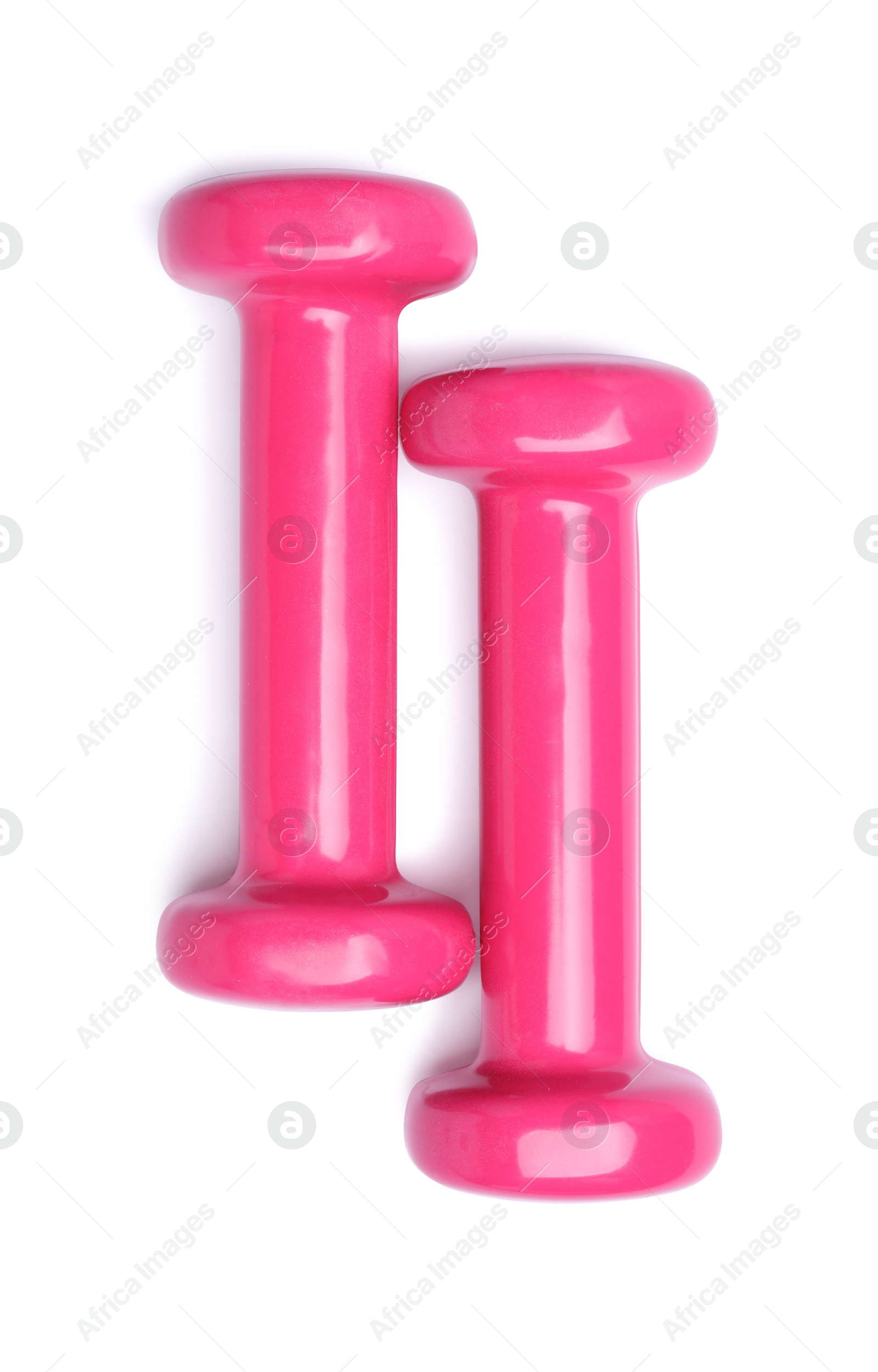 Photo of Pink dumbbells isolated on white, top view. Sports equipment