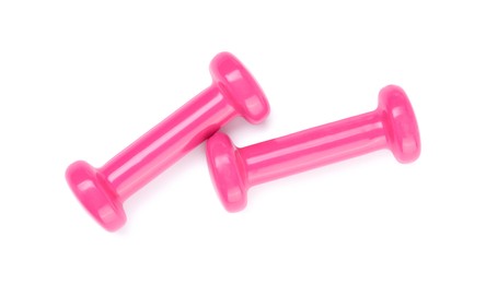 Photo of Pink dumbbells isolated on white, top view. Sports equipment