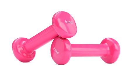 Pink dumbbells isolated on white. Sports equipment