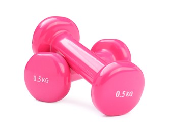 Pink dumbbells isolated on white. Sports equipment