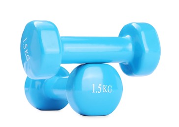 Photo of Light blue dumbbells isolated on white. Sports equipment