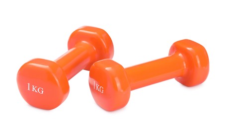 Orange dumbbells isolated on white. Sports equipment