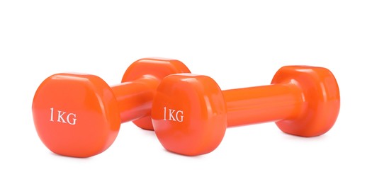 Orange dumbbells isolated on white. Sports equipment