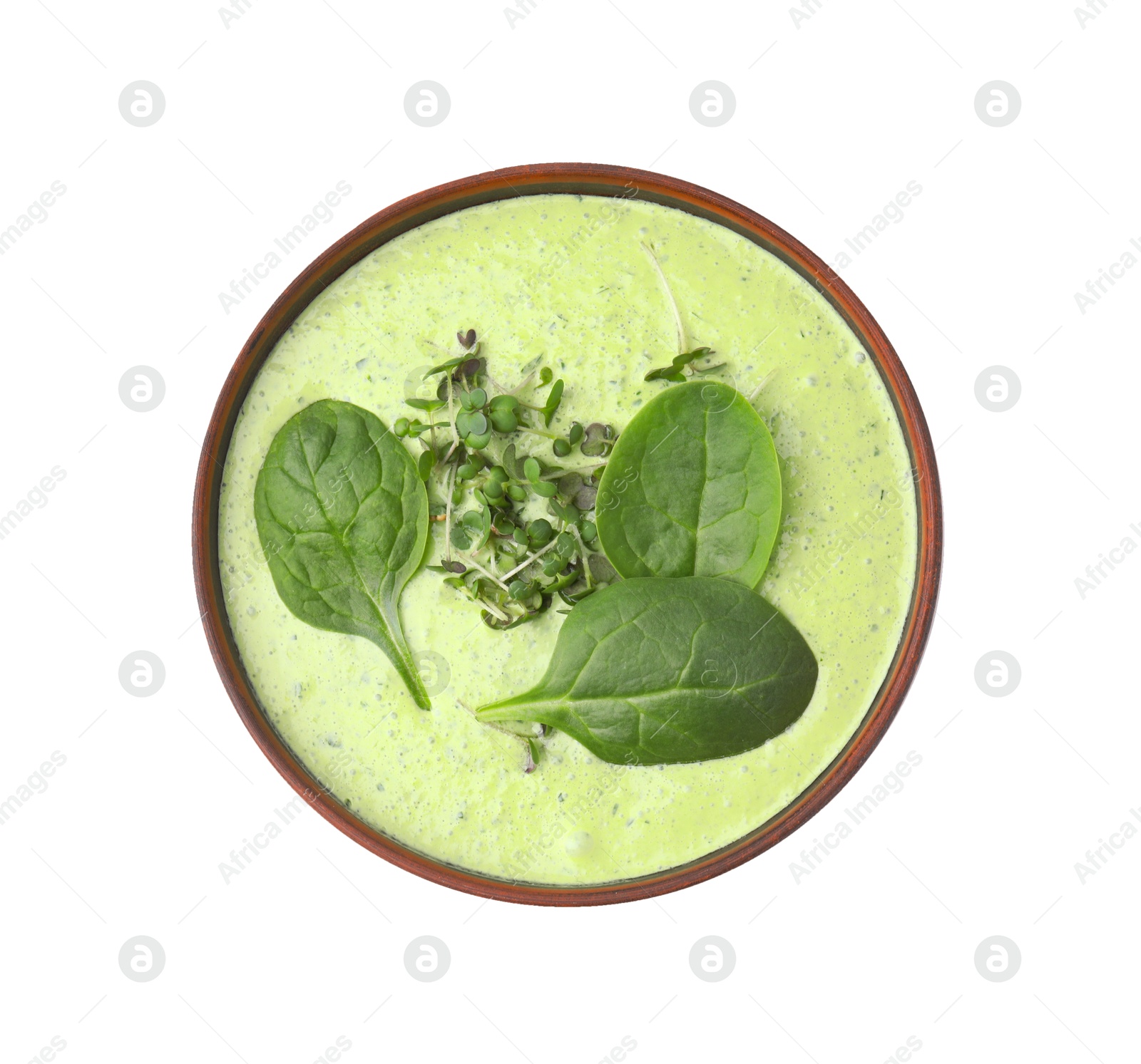 Photo of Delicious spinach cream soup with fresh leaves and microgreens in bowl isolated on white, top view