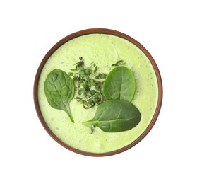 Photo of Delicious spinach cream soup with fresh leaves and microgreens in bowl isolated on white, top view