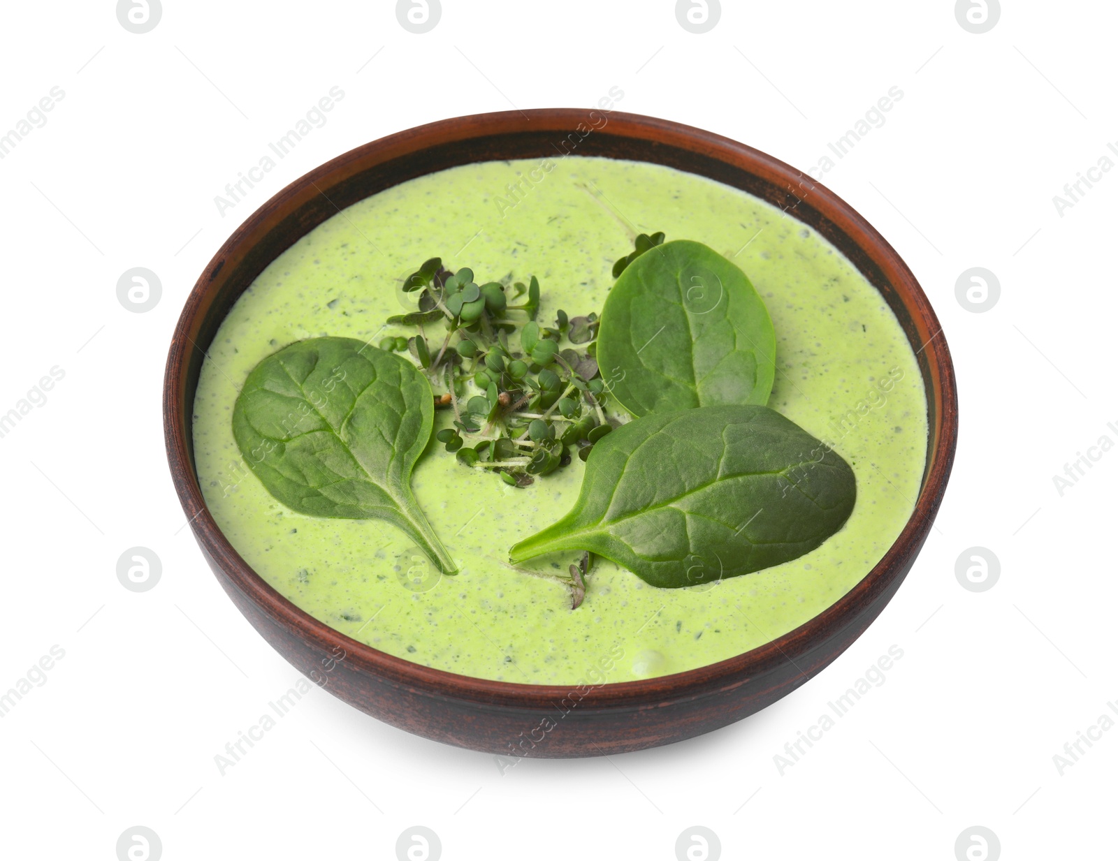 Photo of Delicious spinach cream soup with fresh leaves and microgreens in bowl isolated on white