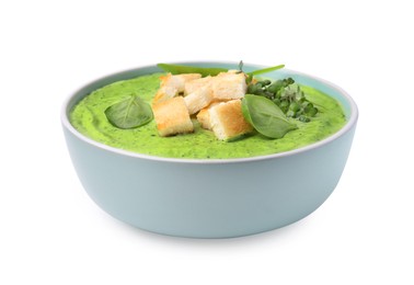 Photo of Delicious spinach cream soup with croutons in bowl isolated on white