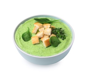 Photo of Delicious spinach cream soup with croutons in bowl isolated on white